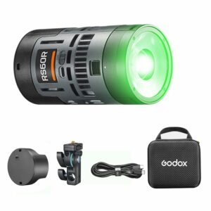 Projecteur LED Godox RS60R allumé en vert, avec batterie, support, câble USB-C et malette Godox